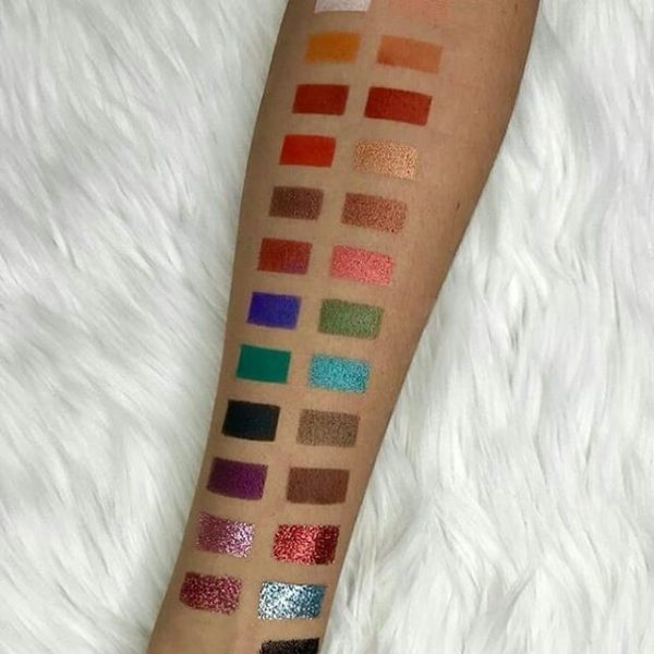 Glitter Galaxy colorful eyeshadow palette swatches featuring matte, shimmer, metallic, and glitter eyeshadow shades on arm.