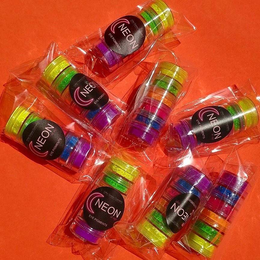 Glitter Galaxy Neon Eye Pigment Collection featuring vibrant multicolor loose neon pigments in travel-friendly cosmetic jars.