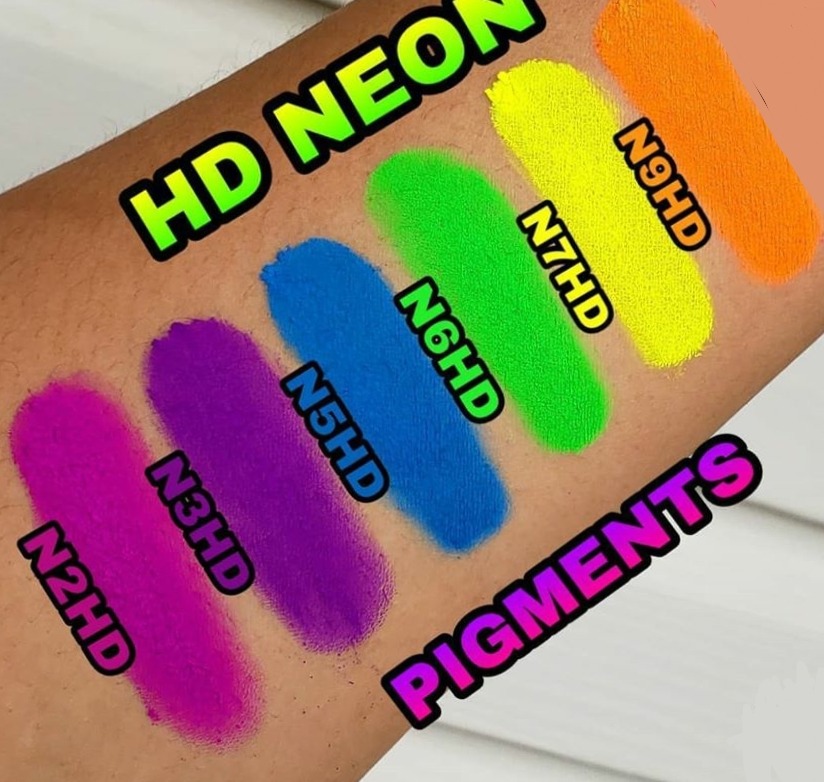 Glitter Galaxy HD Neon Pigments swatches featuring bright pink, purple, blue, green, yellow, and orange neon eye makeup colors on arm