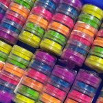 Glitter Galaxy Neon Pigment Stack Collection featuring vibrant multicolor loose neon pigments in stacked cosmetic jars.