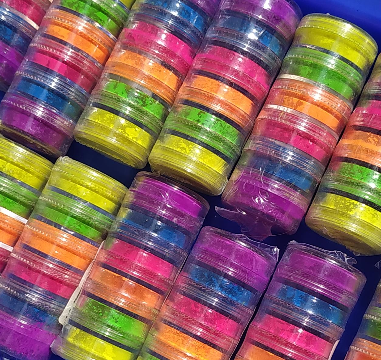 Glitter Galaxy Neon Pigment Stack Collection featuring vibrant multicolor loose neon pigments in stacked cosmetic jars.