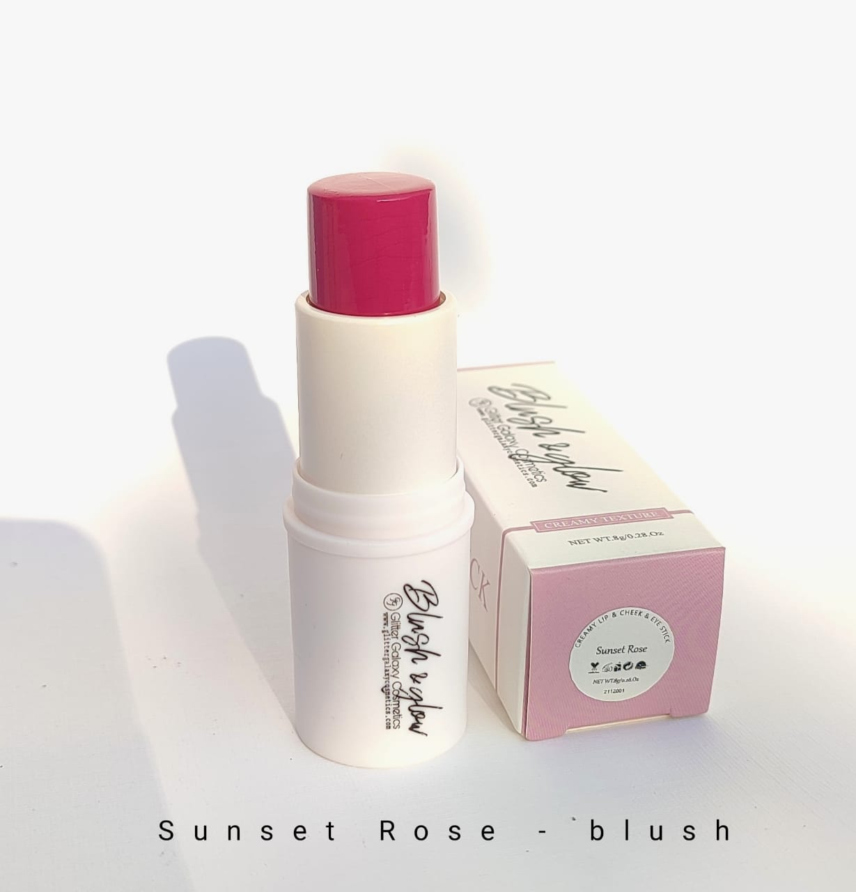 Glitter Galaxy Cosmetics Sunset Rose Blush Stick featuring a creamy vibrant rose pink blush in a twist-up stick with elegant pastel packaging for a fresh radiant finish.