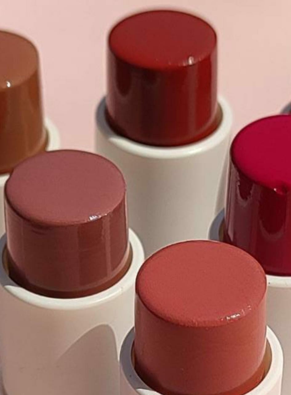 Glitter Galaxy Cosmetics Blush & Glow cream blush stick collection featuring multiple creamy blush shades in nude, peach, rose, berry, and deep red tones with a smooth satin finish.