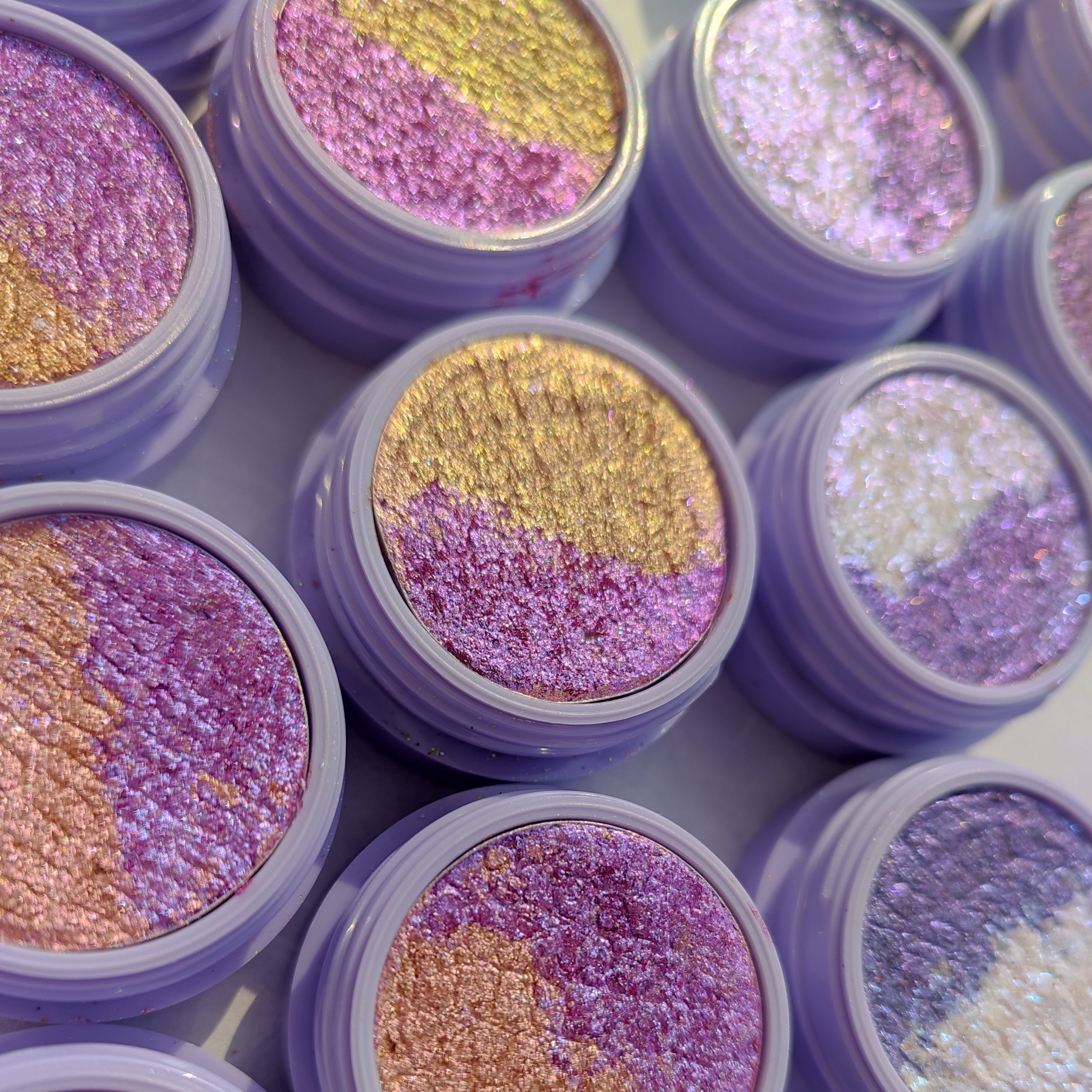 glitter galaxy limited edition valentine duo eyeshadow collection featuring pink, gold, lilac, blue, and pearl multichrome foiled shimmer shades.