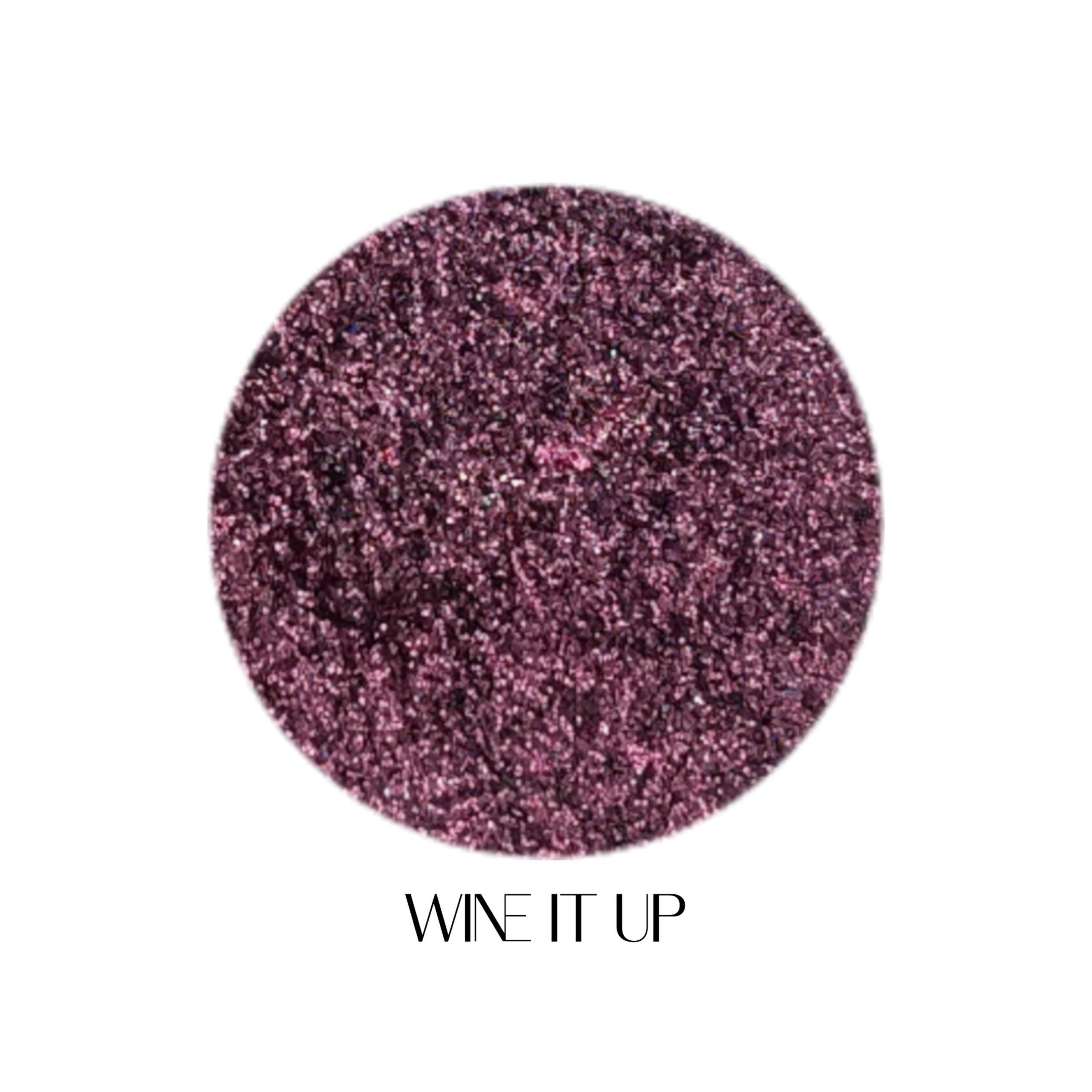 Glitter Galaxy Cosmetics Wine It Up holographic cosmetic glitter featuring ultra-fine wine plum shimmer with mauve, burgundy, and rainbow reflective multidimensional sparkle.