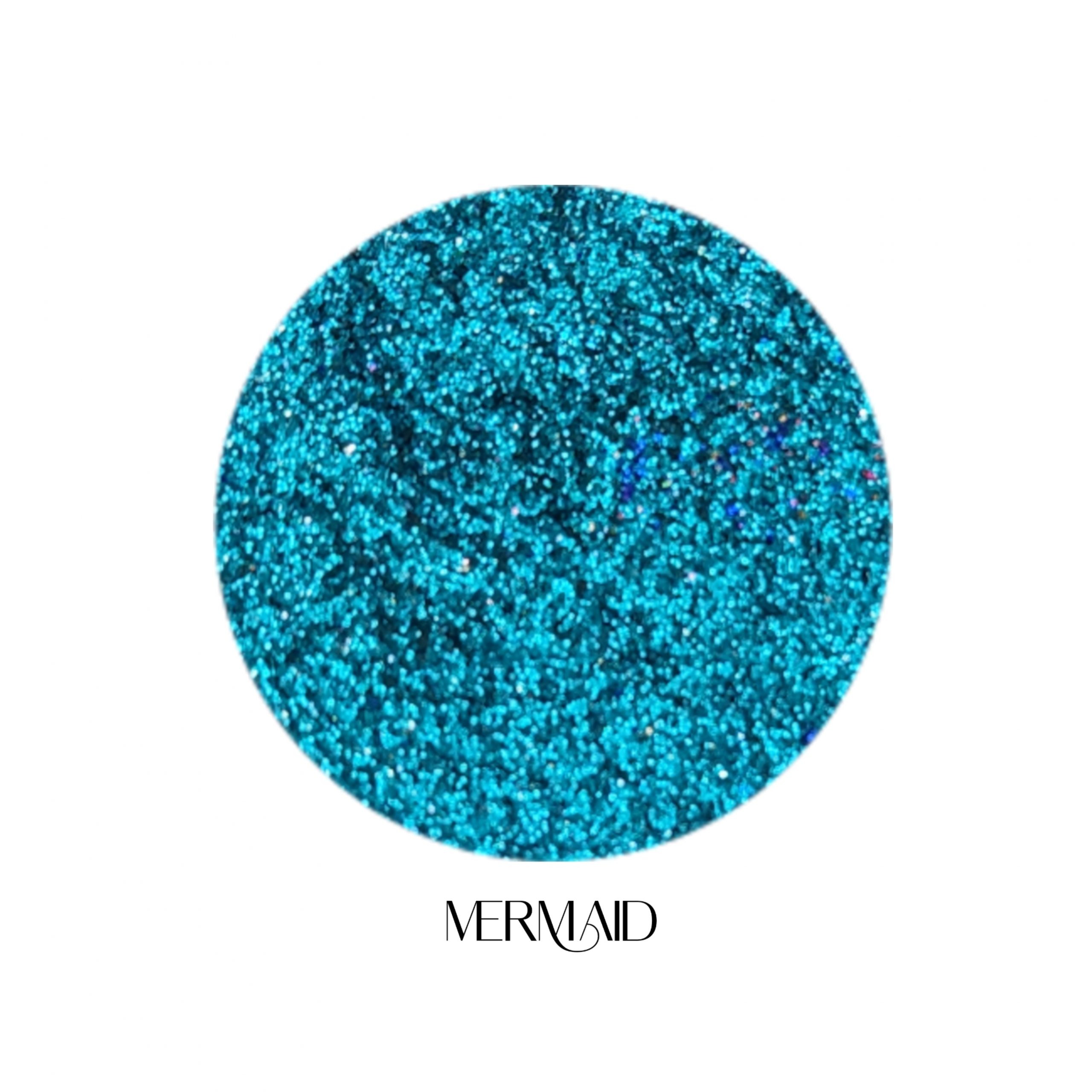 Glitter Galaxy Cosmetics Mermaid holographic cosmetic glitter featuring ultra-fine turquoise blue shimmer with aqua, teal, and rainbow reflective multidimensional sparkle.