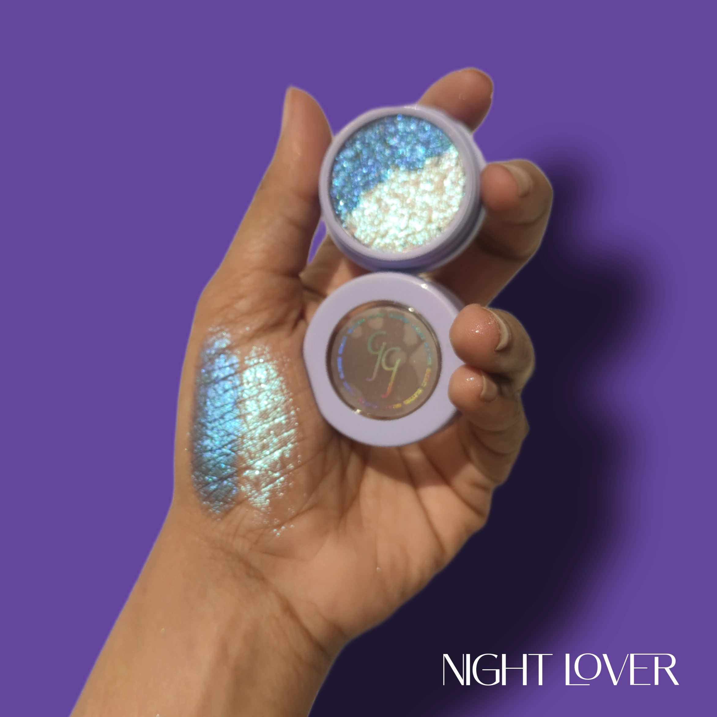 glitter galaxy night lover superfoiled single eyeshadow with blue and silver multichrome shimmer, high-pigment foiled finish, and real hand swatch.